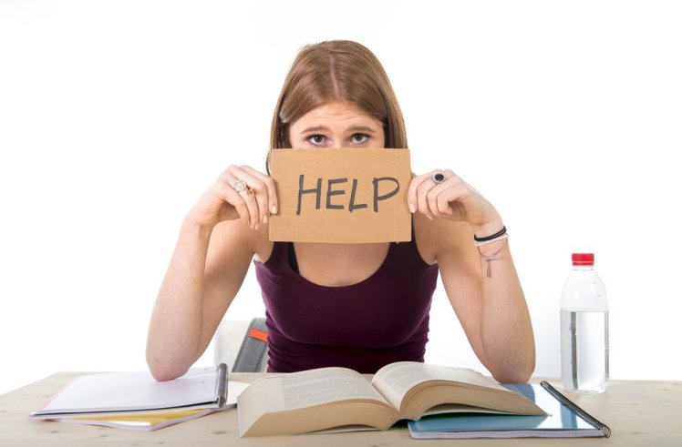 college student girl studying for university exam worried in stress asking for help